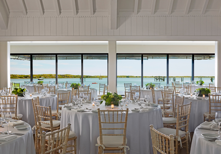 ballroom with tables overlooking waterfront