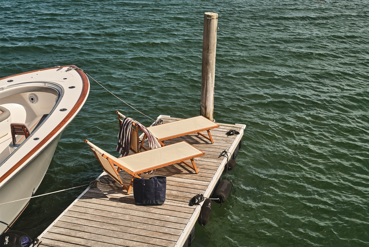 dock with boat and chairs