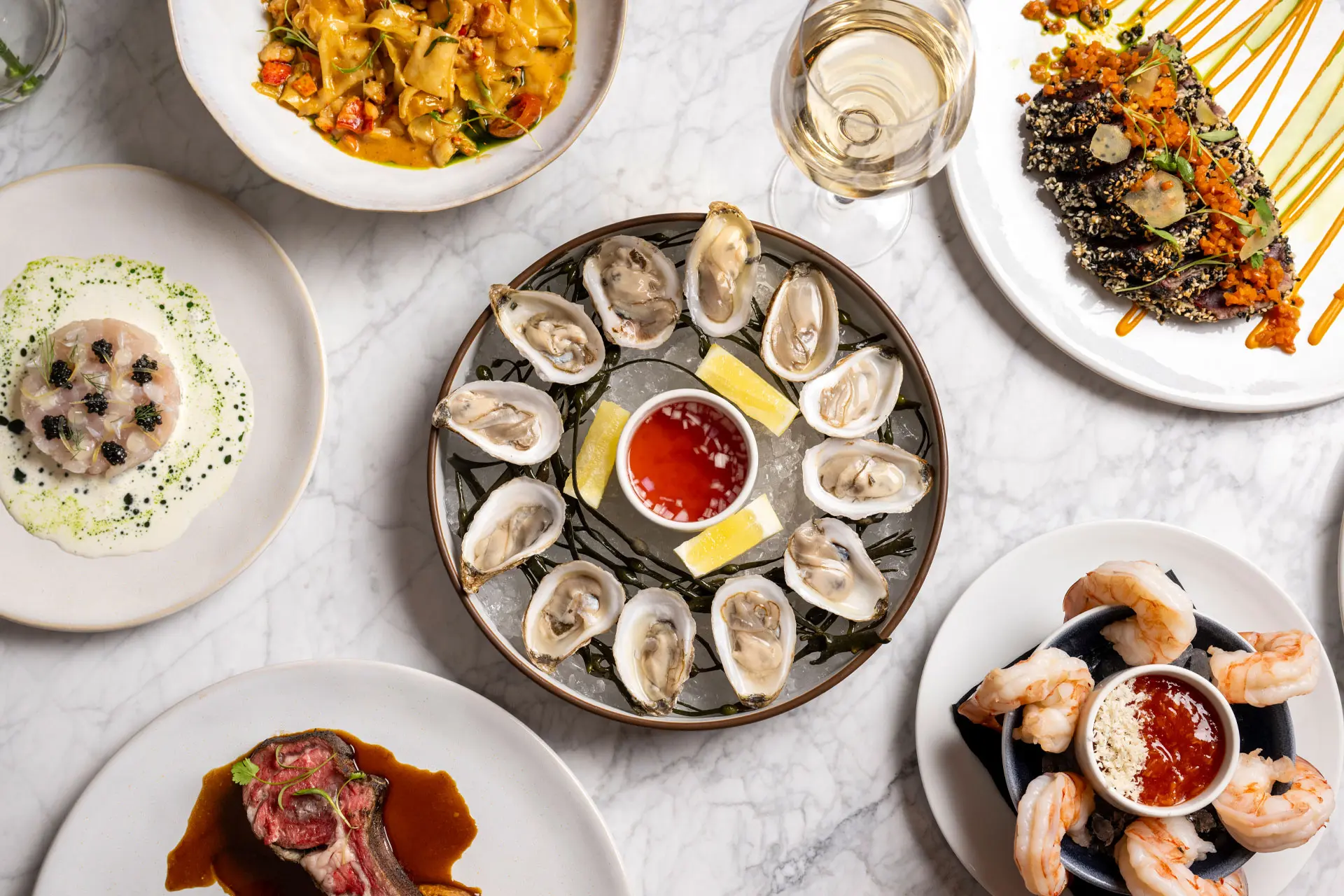 A variety of delicious seafood served on a marble-finished table.