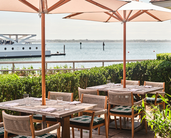 tables by the water